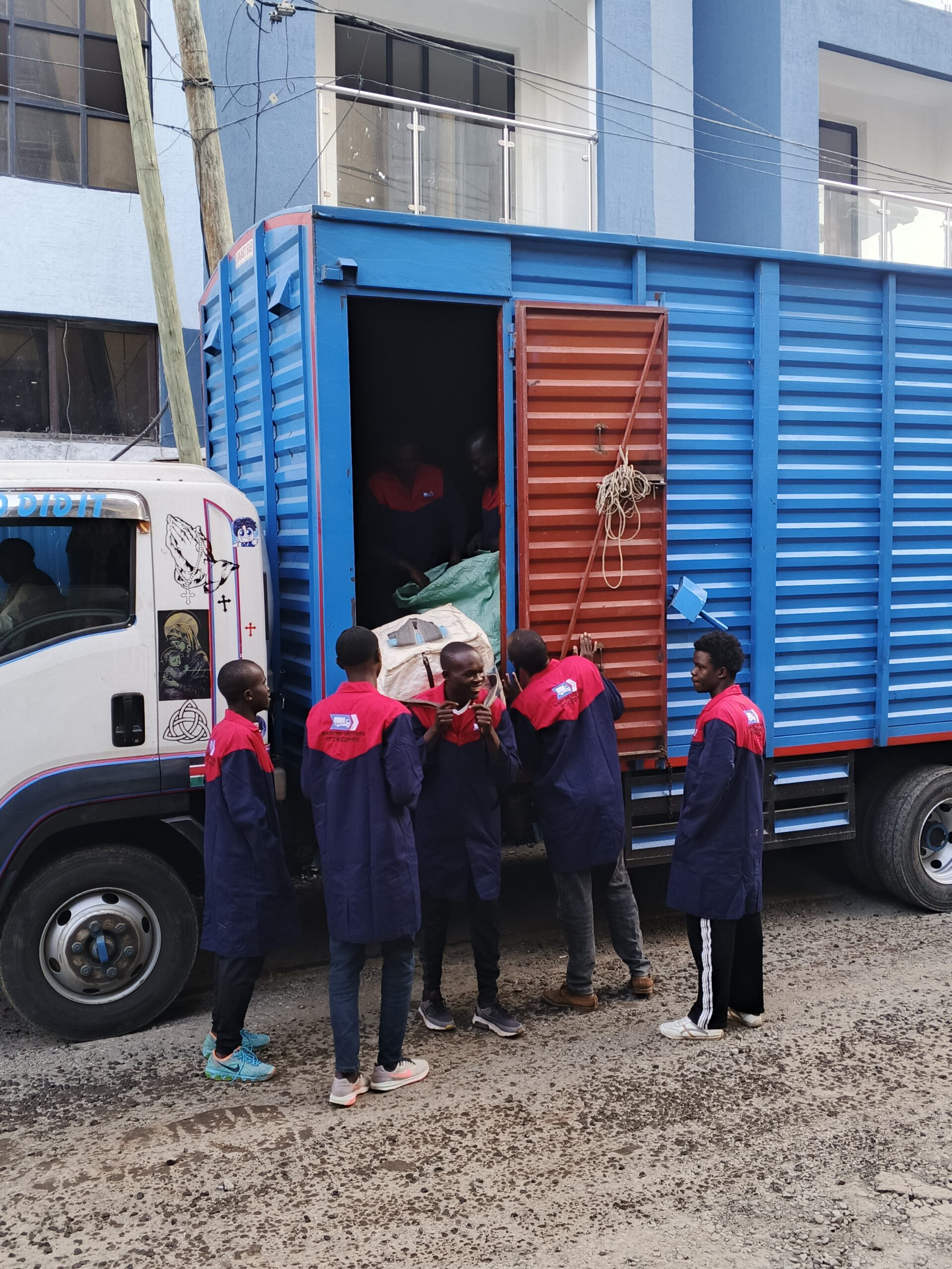 Long-distance movers from Nairobi Movers loading a truck