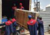 Professional house movers from Nairobi Movers safely offloading furniture