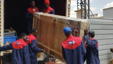 Professional house movers from Nairobi Movers safely offloading furniture